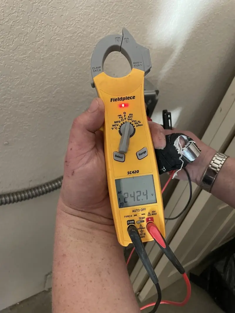 Voltage testing with clamp meter during Electrical Installation Services in New Whiteland